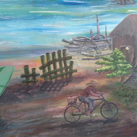 Details from a mural that depict a filipino man cycling in the coastal community Guiuan.